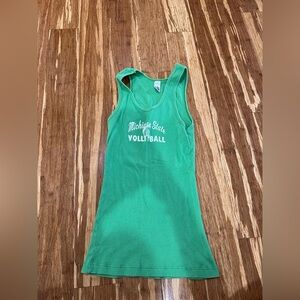 One women’s tank top one size with three small stains (easily come out)